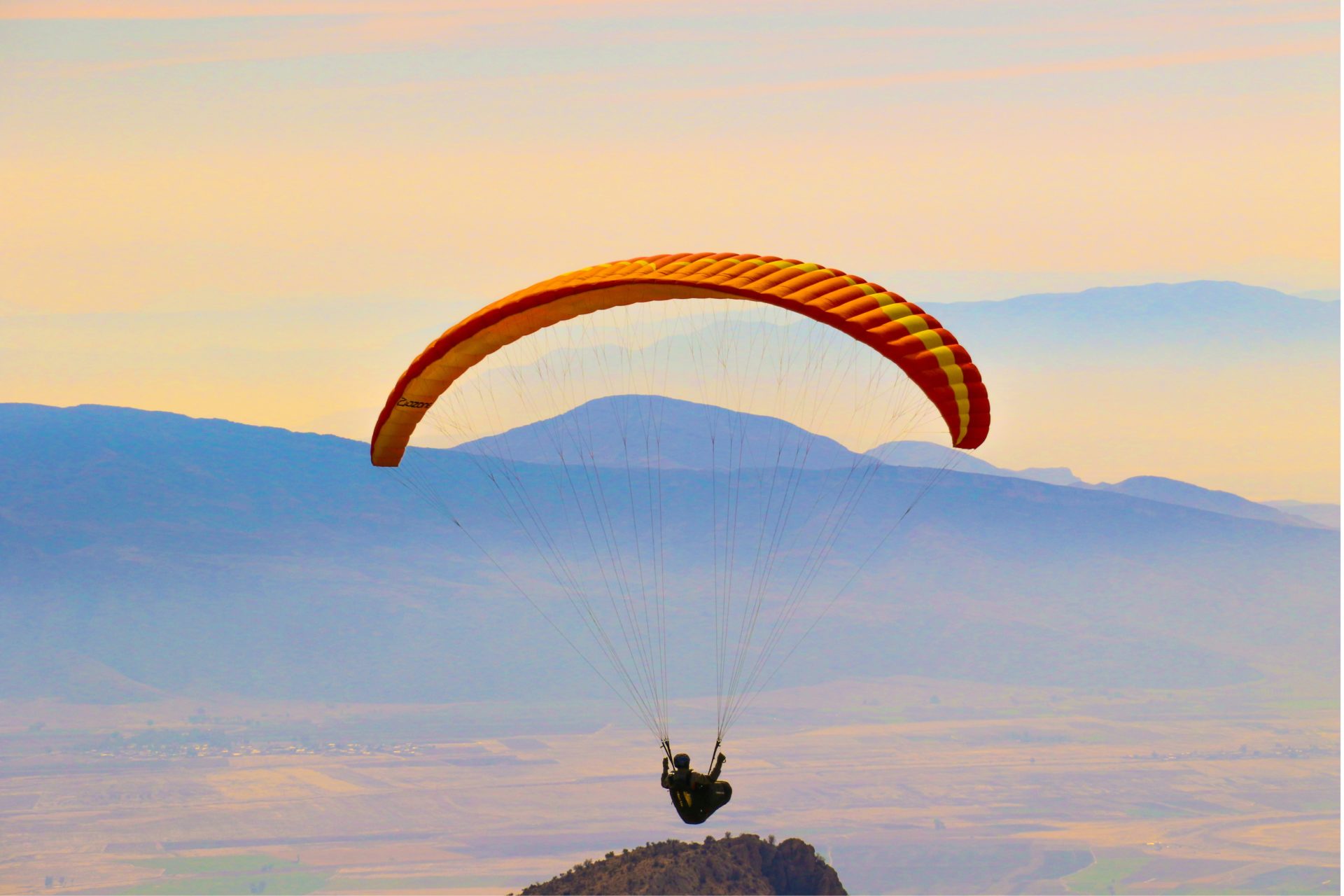 person riding parachute